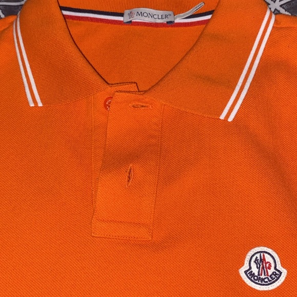 Moncler designer shirt worn one for photoshoot two colors available .